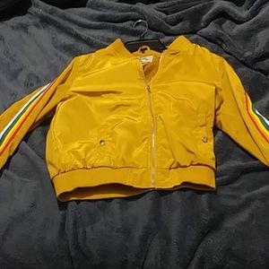 A mustard color rain jacket